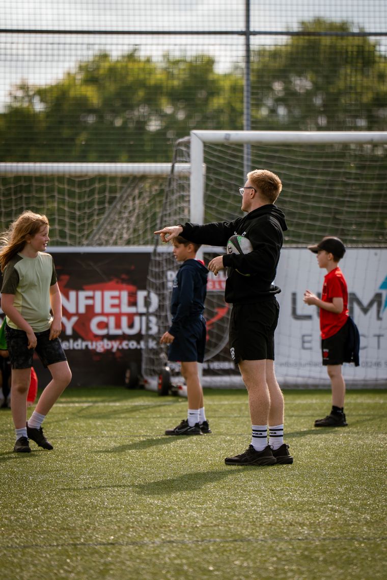 Coach directing players during a game